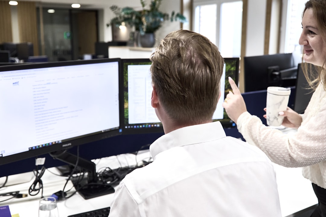 Professional finance team reviewing payroll